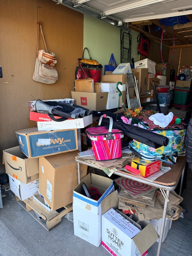Before: second view of packed garage before junk removal