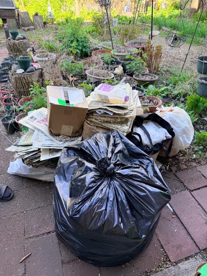 Patio cleanout in Minneapolis — boxes and bags removed by SHINENOS crew